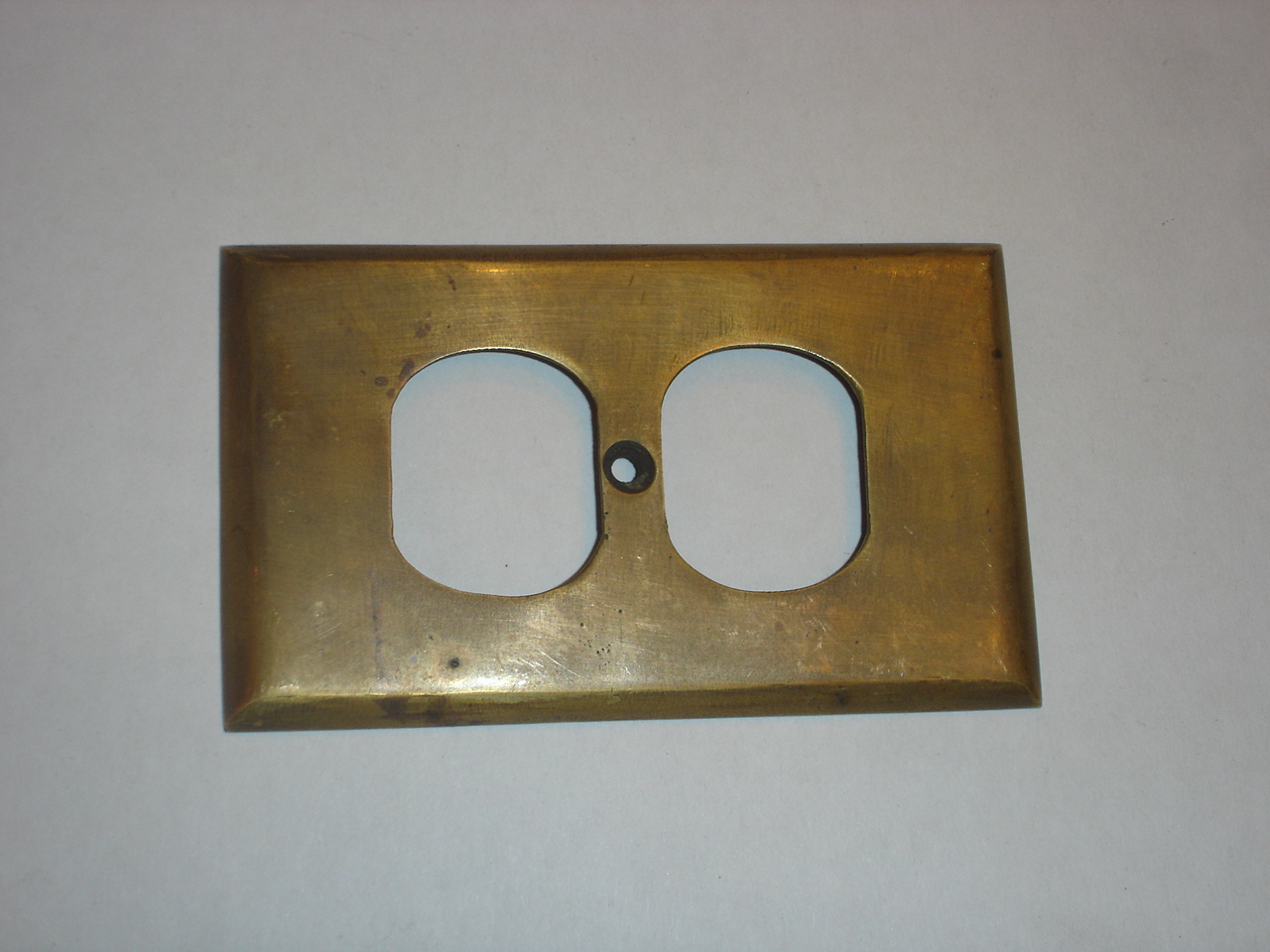 Brass switch cover Code AE.049 size L:115 mm W: 71 mm.